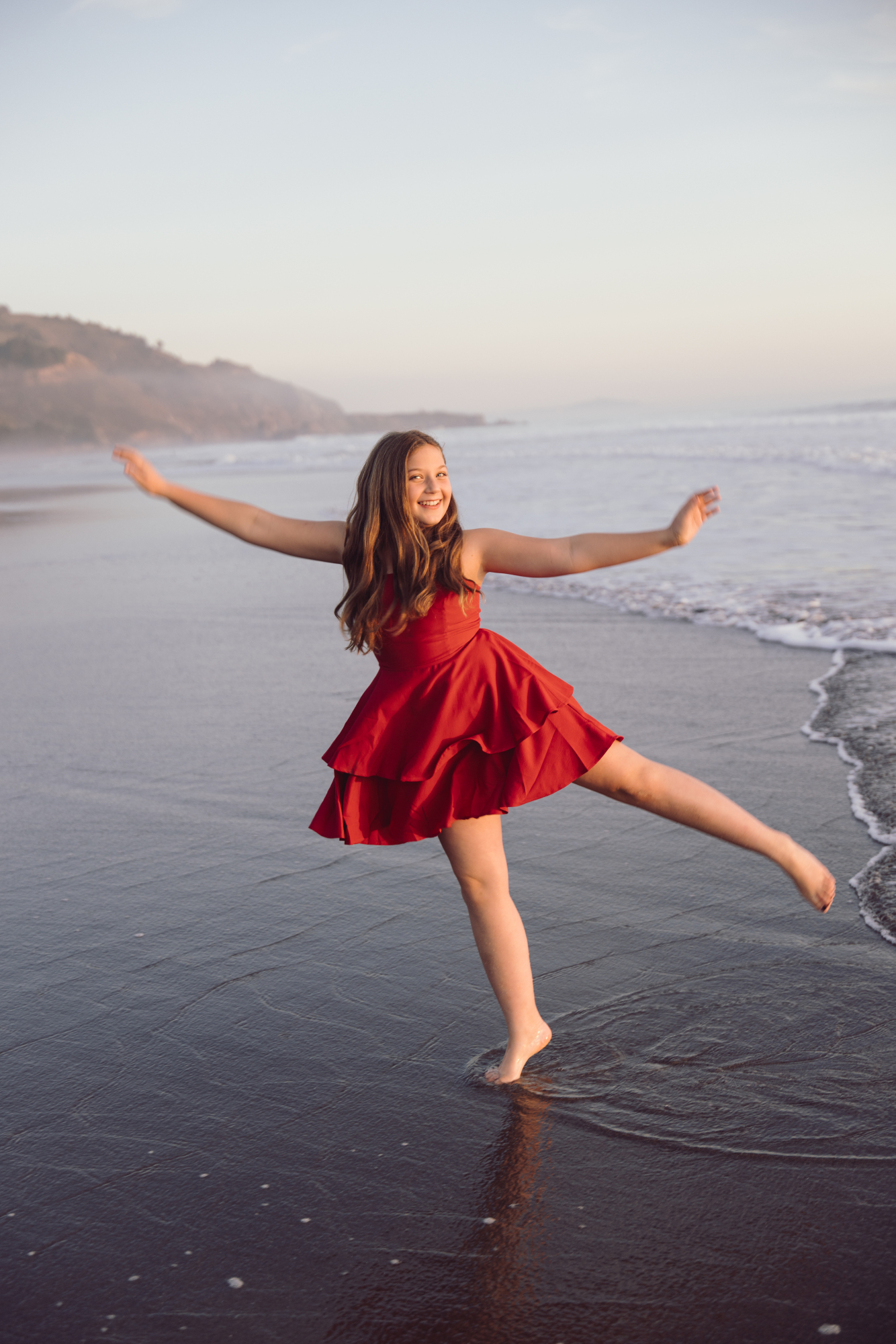 Playful ocean portrait by Delaware beach family photographer