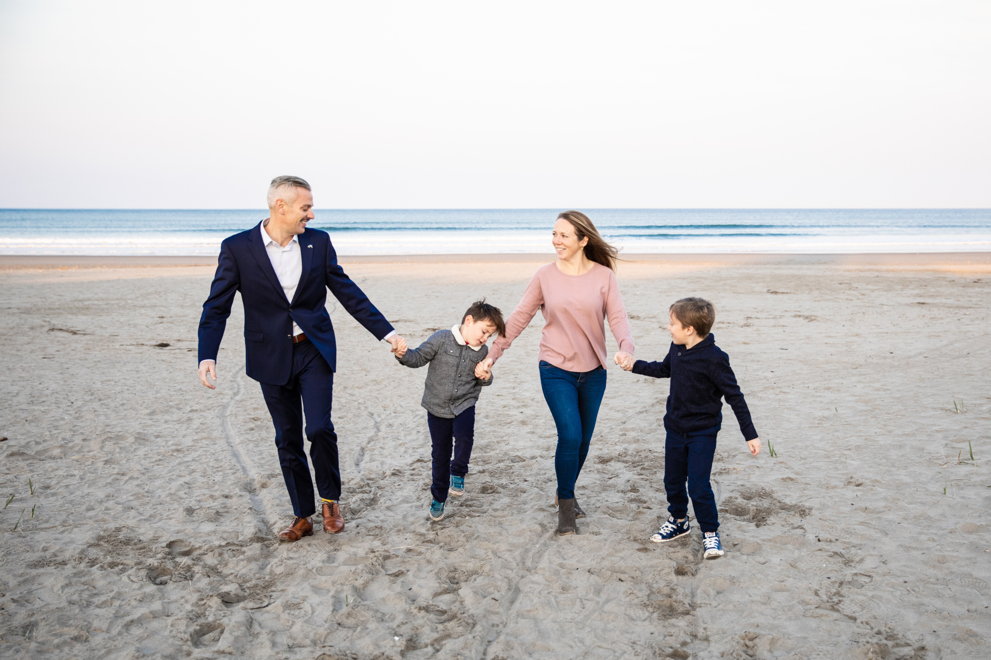 Seaside family moment by beach family photographer