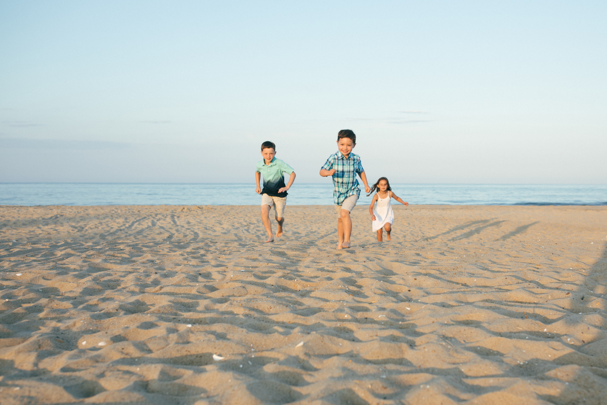 Family sunset portrait by beach family photographer in Delaware